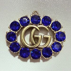 Stunning Gucci Upcycled GG Zipper Pull Charm Gold
Tone & Blue Rhinestone Pendant